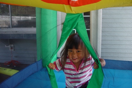 Kasen playing in her bounce house